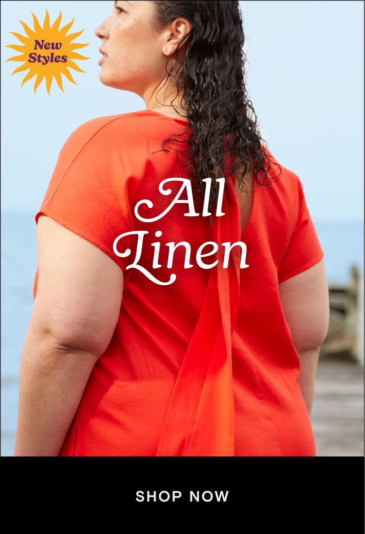 woman wearing red linen dress with tie at the back and a cta that links to the linen collection