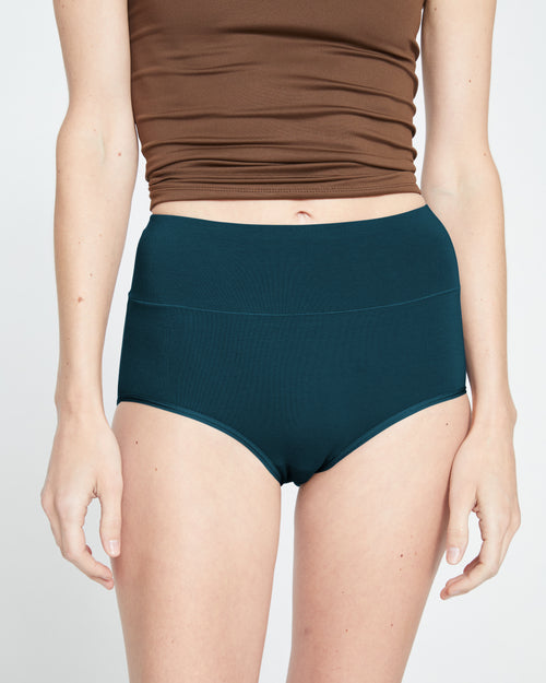 Woman wearing UltimateS Full Coverage High Rise Brief - Deep Sea from Universal Standard