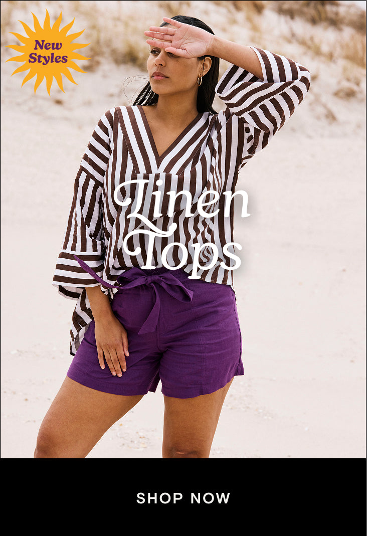 woman wearing white and brown striped linen long sleeve top with purple linen shorts and a cta that links to the linen tops