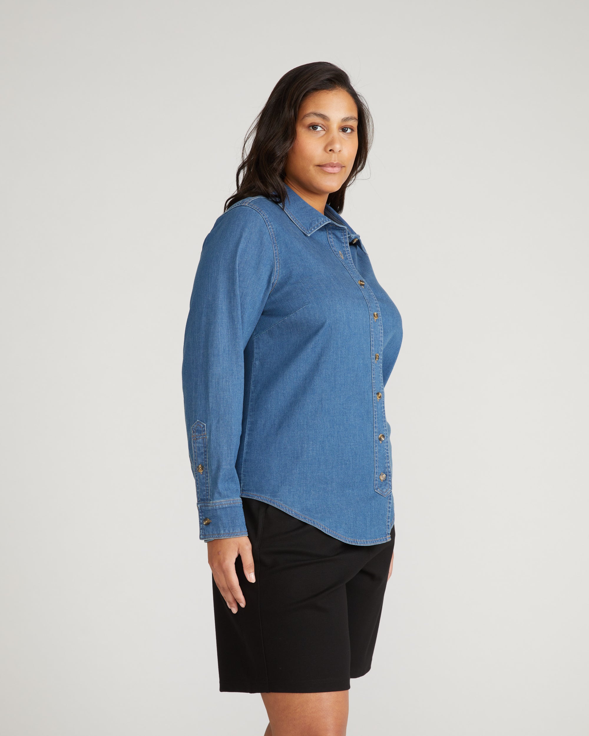 Woman wearing Minimalist Stretch Cotton Chambray Shirt - Orion Blue from Universal Standard