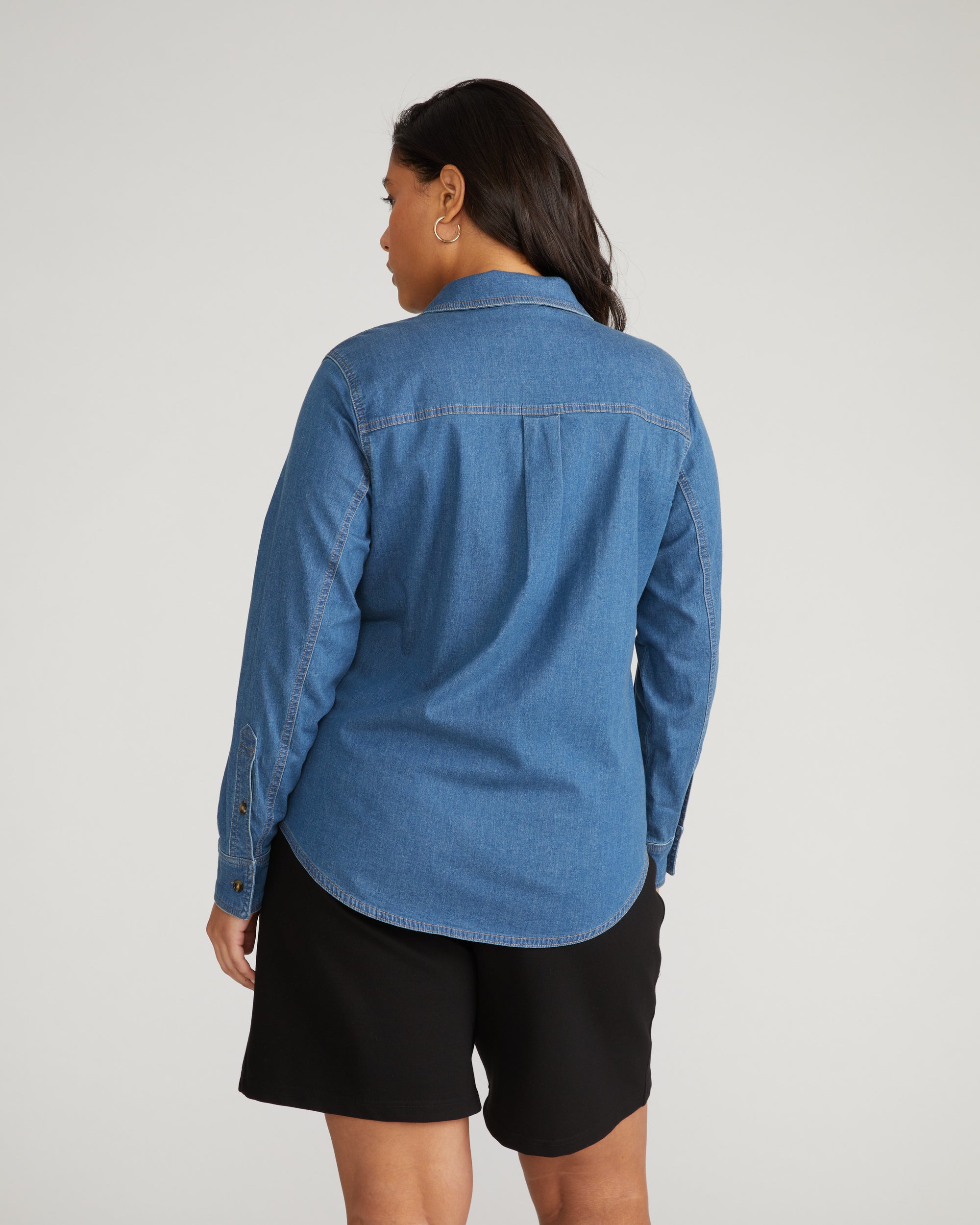 Woman wearing Minimalist Stretch Cotton Chambray Shirt - Orion Blue from Universal Standard