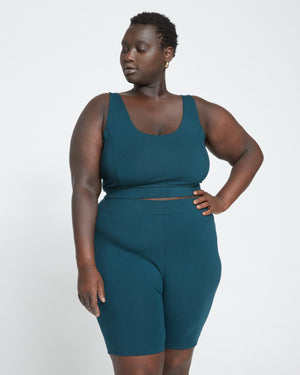 Woman wearing Roya Bike Shorts - Deep Sea from Universal Standard
