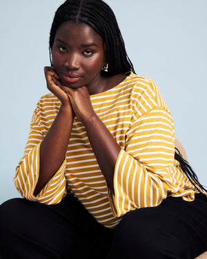 Woman wearing Montauk Breton Stripe Bell Sleeve Top - Mustard/Cream Stripe from Cart Upsell