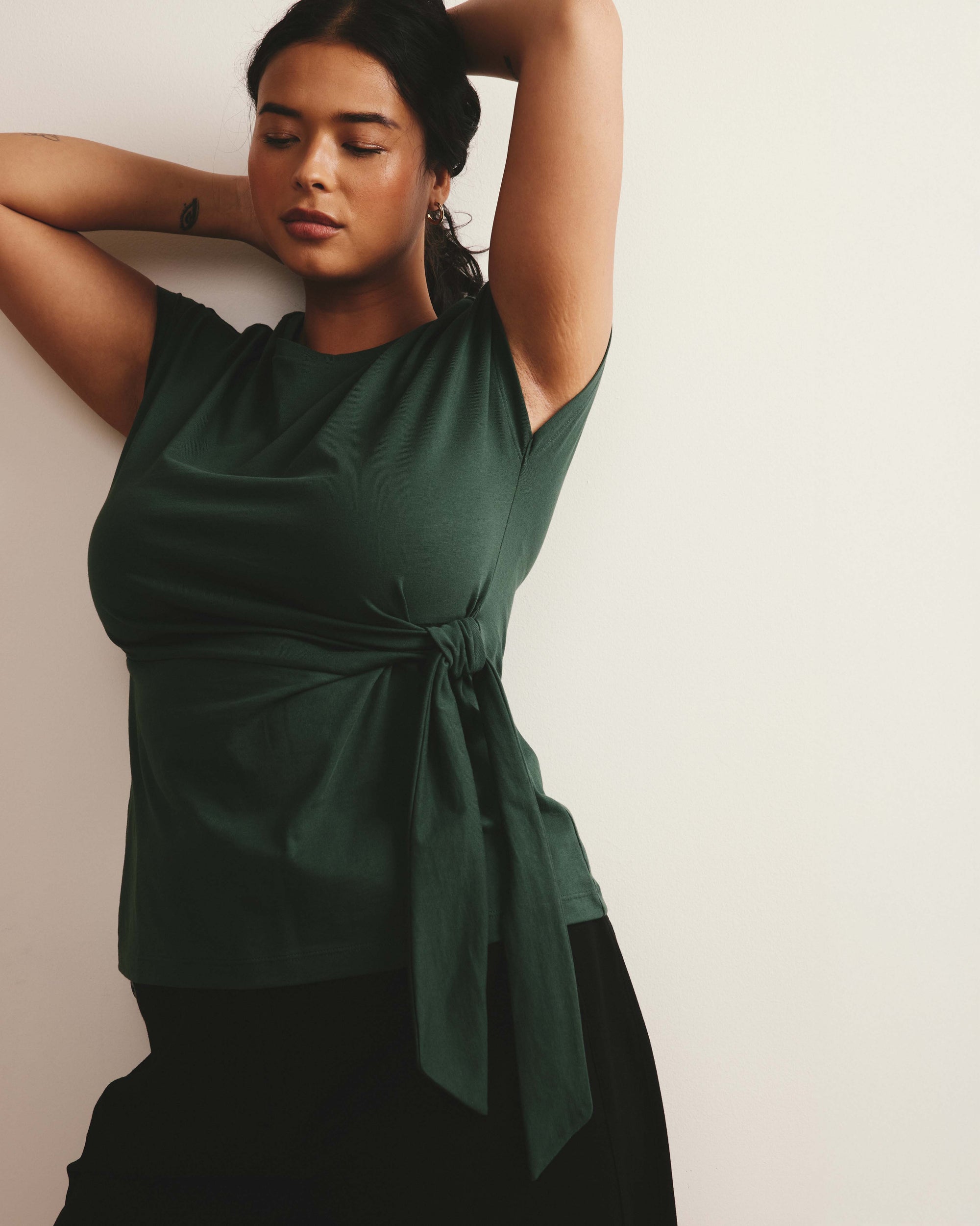 Woman wearing Crescent Breton Stripe Knot Tee - Solid Conifer from Universal Standard