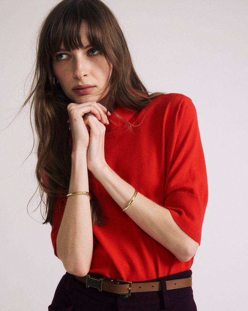 Woman wearing Savvy Fine Knit Turtleneck Sweater Top - Lipstick from Universal Standard