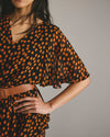 Milou V-Neck Peplum Chiffon Top - Black/Orange Dot Print