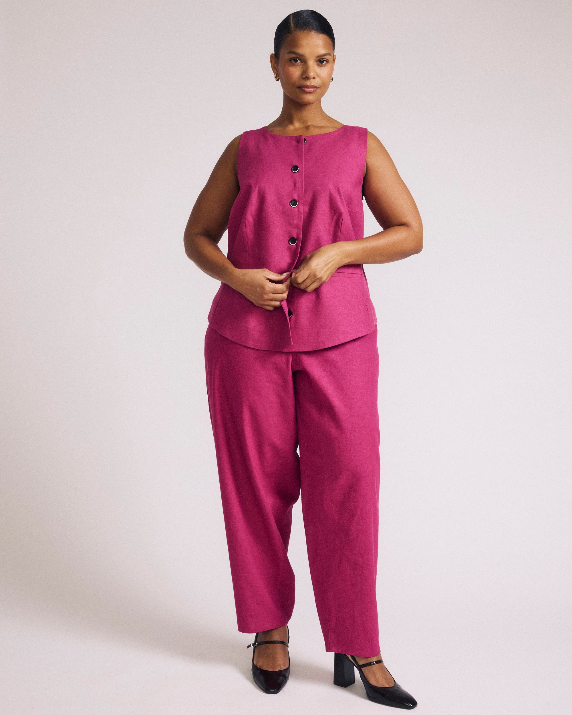 Woman wearing Tamsin Stretch Linen Vest - Hyper Pink from Universal Standard