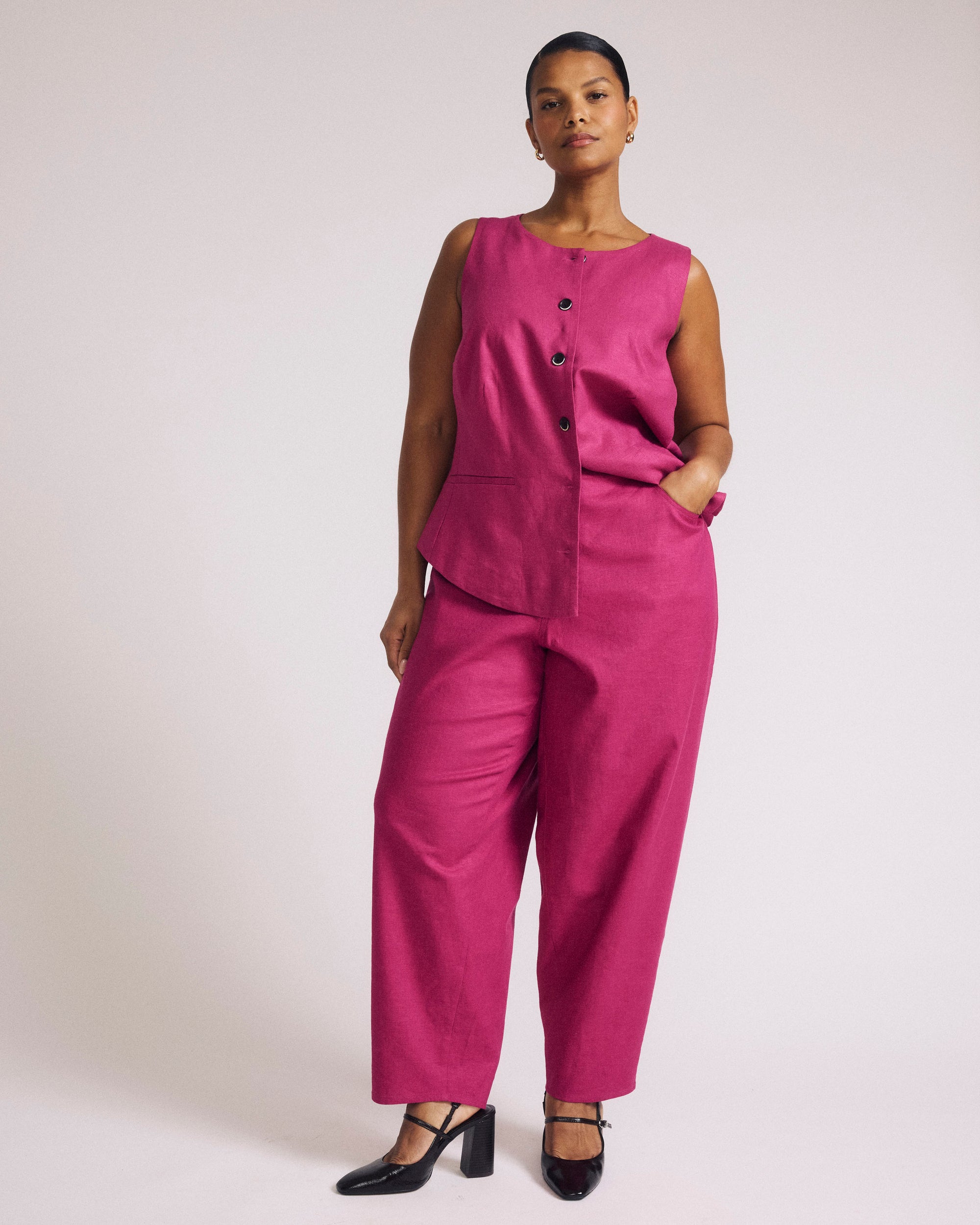 Woman wearing Lou Barrel Leg Linen Pants - Hyper Pink from Universal Standard