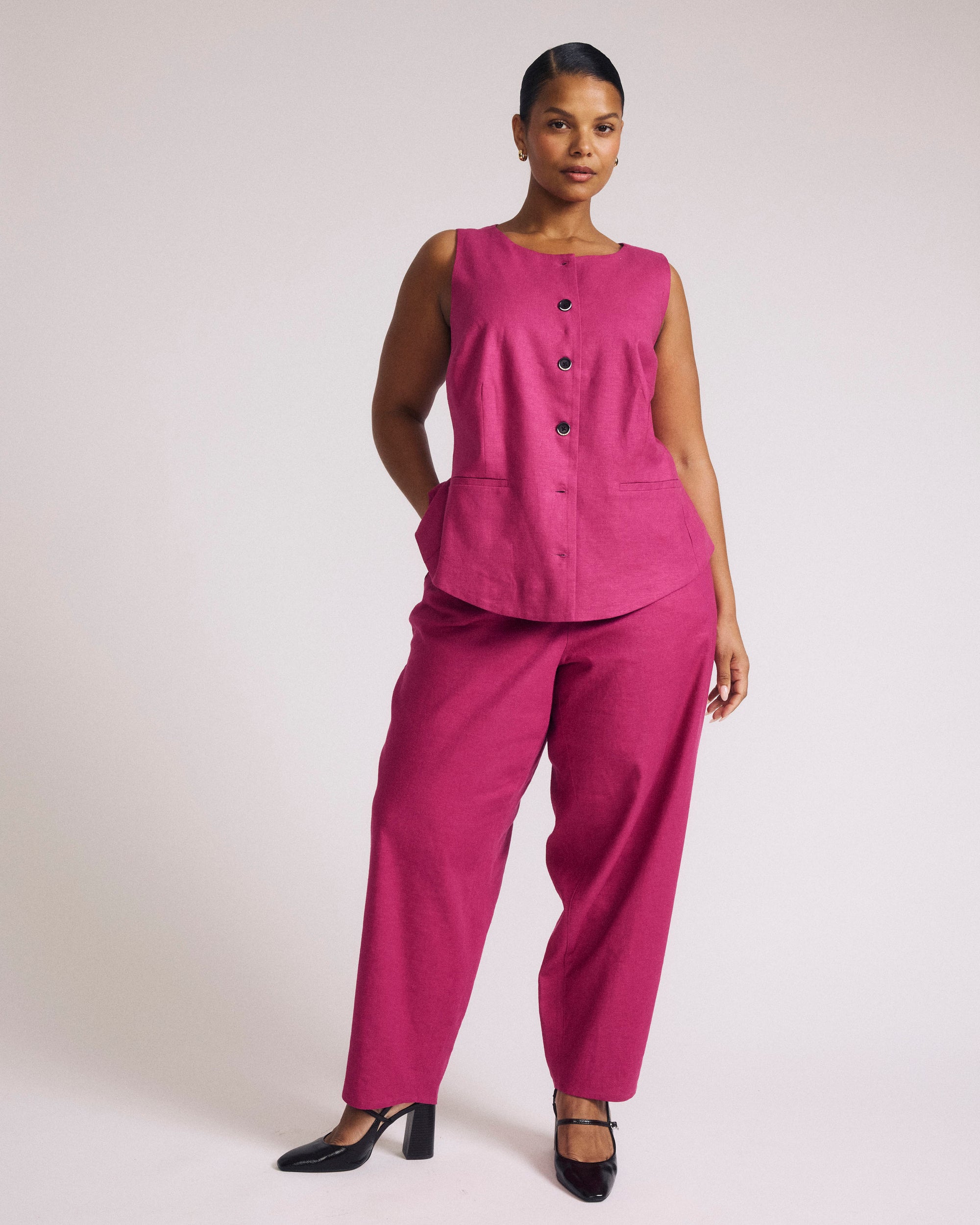 Woman wearing Tamsin Stretch Linen Vest - Hyper Pink from Universal Standard
