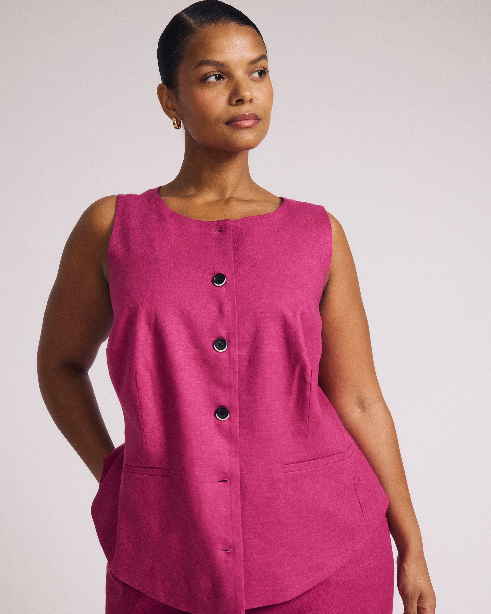 Woman wearing Tamsin Stretch Linen Vest - Hyper Pink from Universal Standard