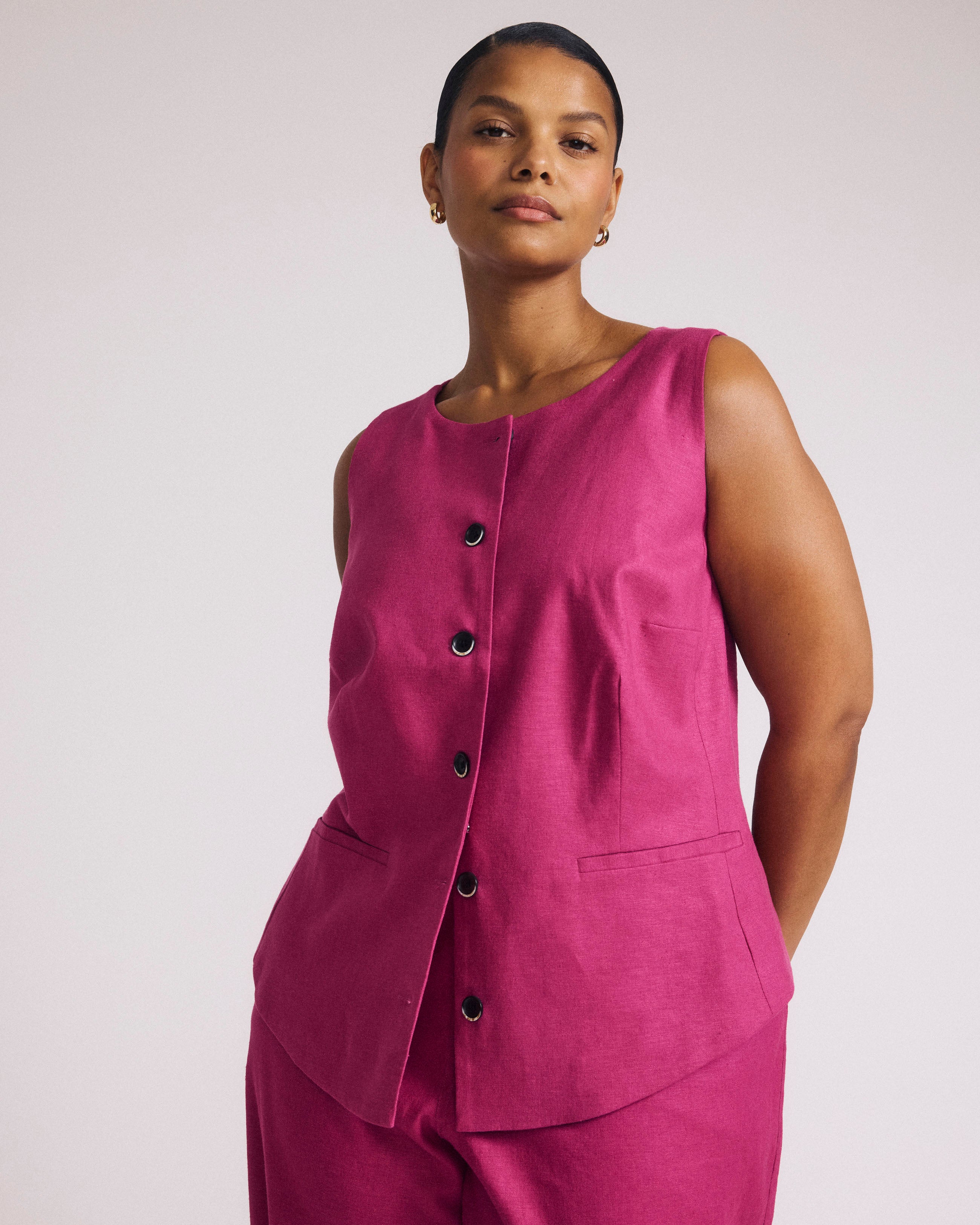 Woman wearing Tamsin Stretch Linen Vest - Hyper Pink from Universal Standard