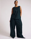 Woman wearing Tamsin Stretch Linen Vest - Forest Green from Universal Standard