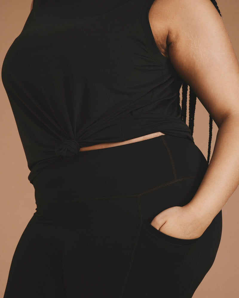 Woman wearing Next-to-Naked Cropped Pocket Legging - Deep Brown from Universal Standard