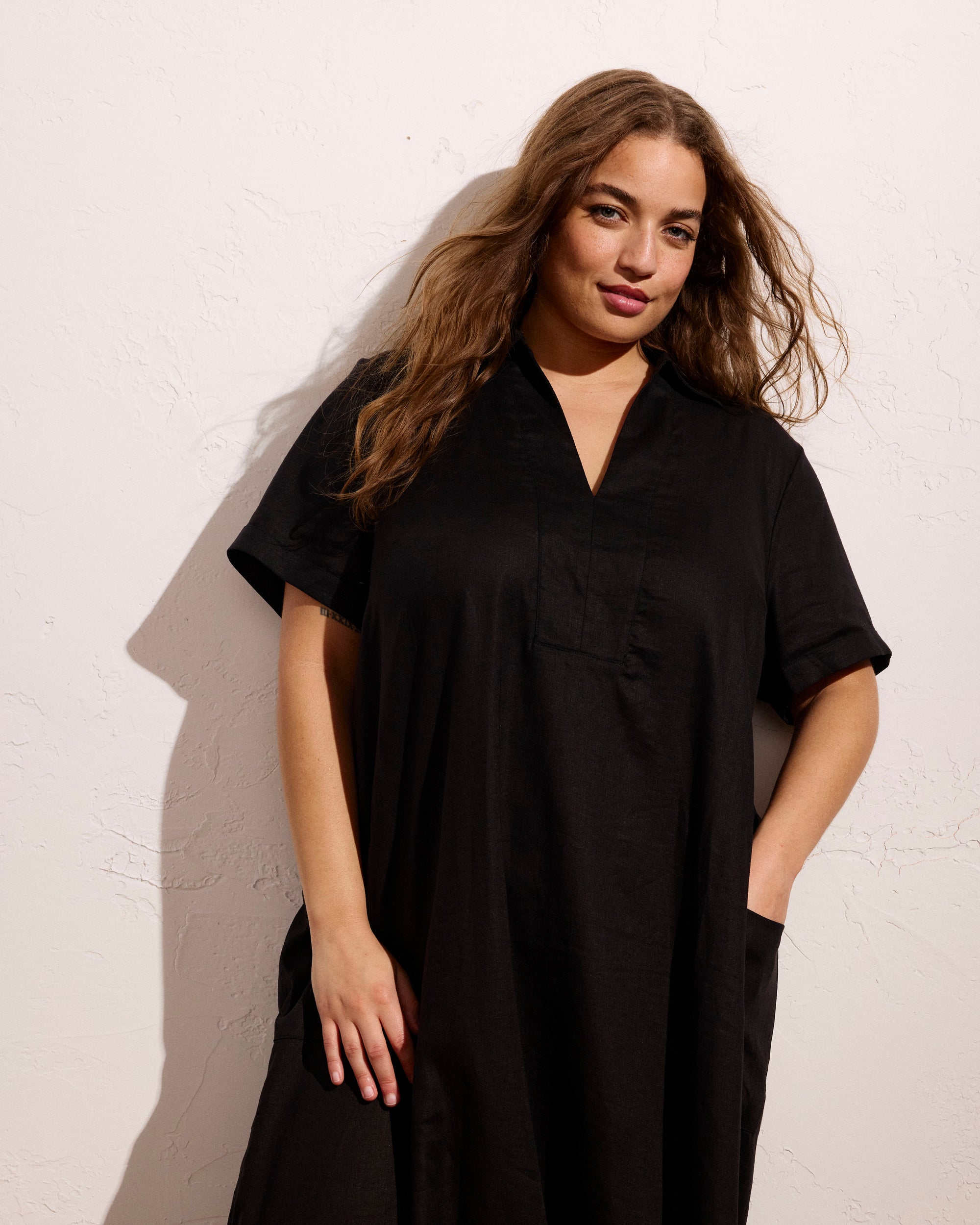 Woman wearing Padma Polo Neck Linen Dress - Black from Universal Standard