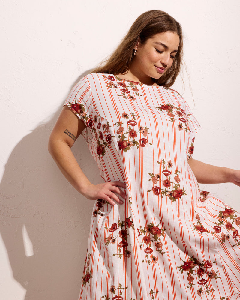 Woman wearing Sunset Linen Flounce Dress - Wild Flower Bouquet Print on Stripes from Universal Standard
