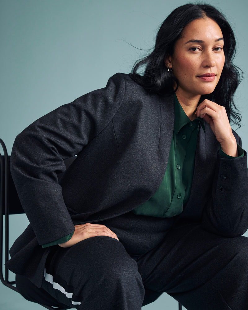 Woman wearing Lennox Collarless Ponte Blazer - Charcoal Denim from Universal Standard