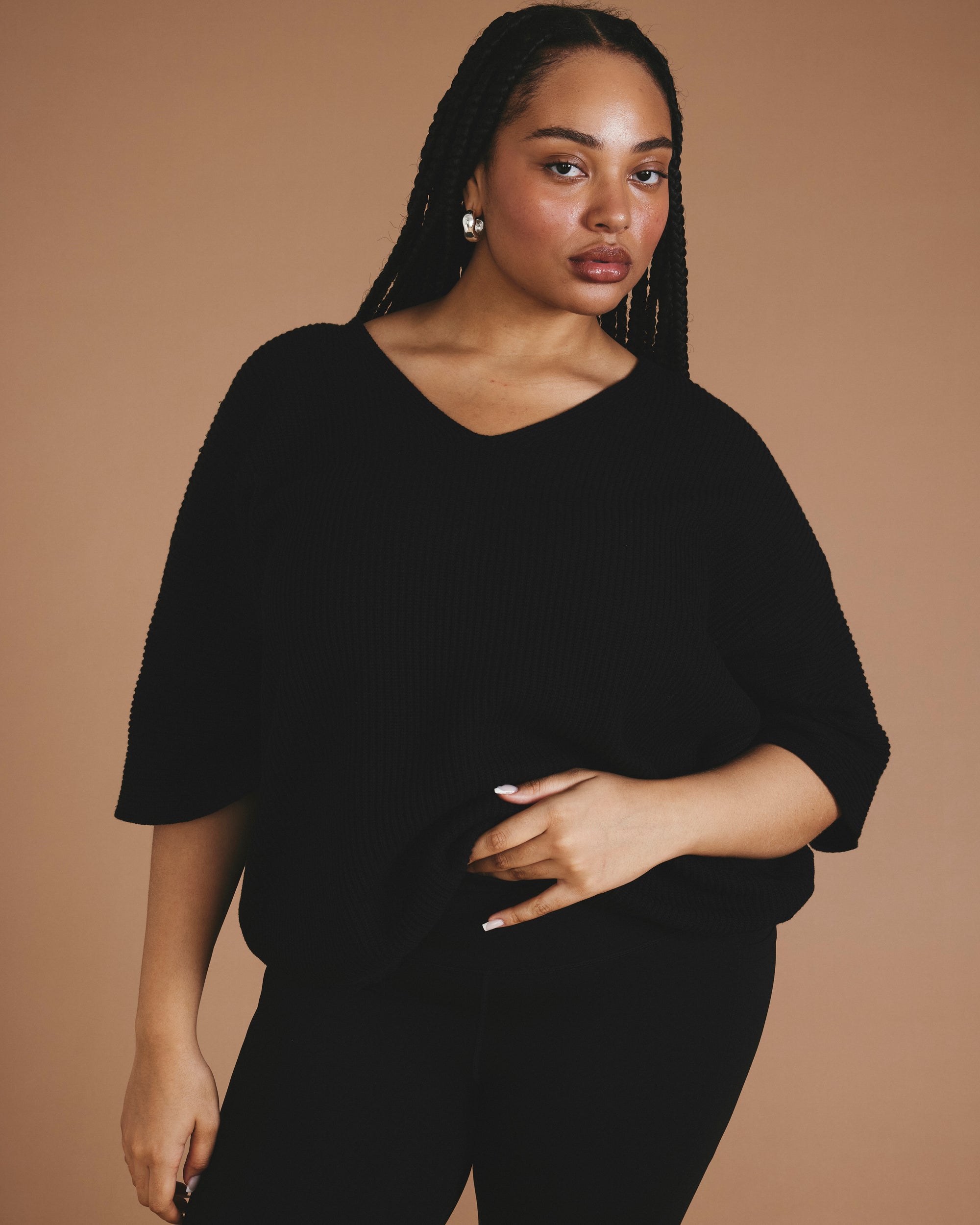 Woman wearing Lotus Sweater - Black from Universal Standard