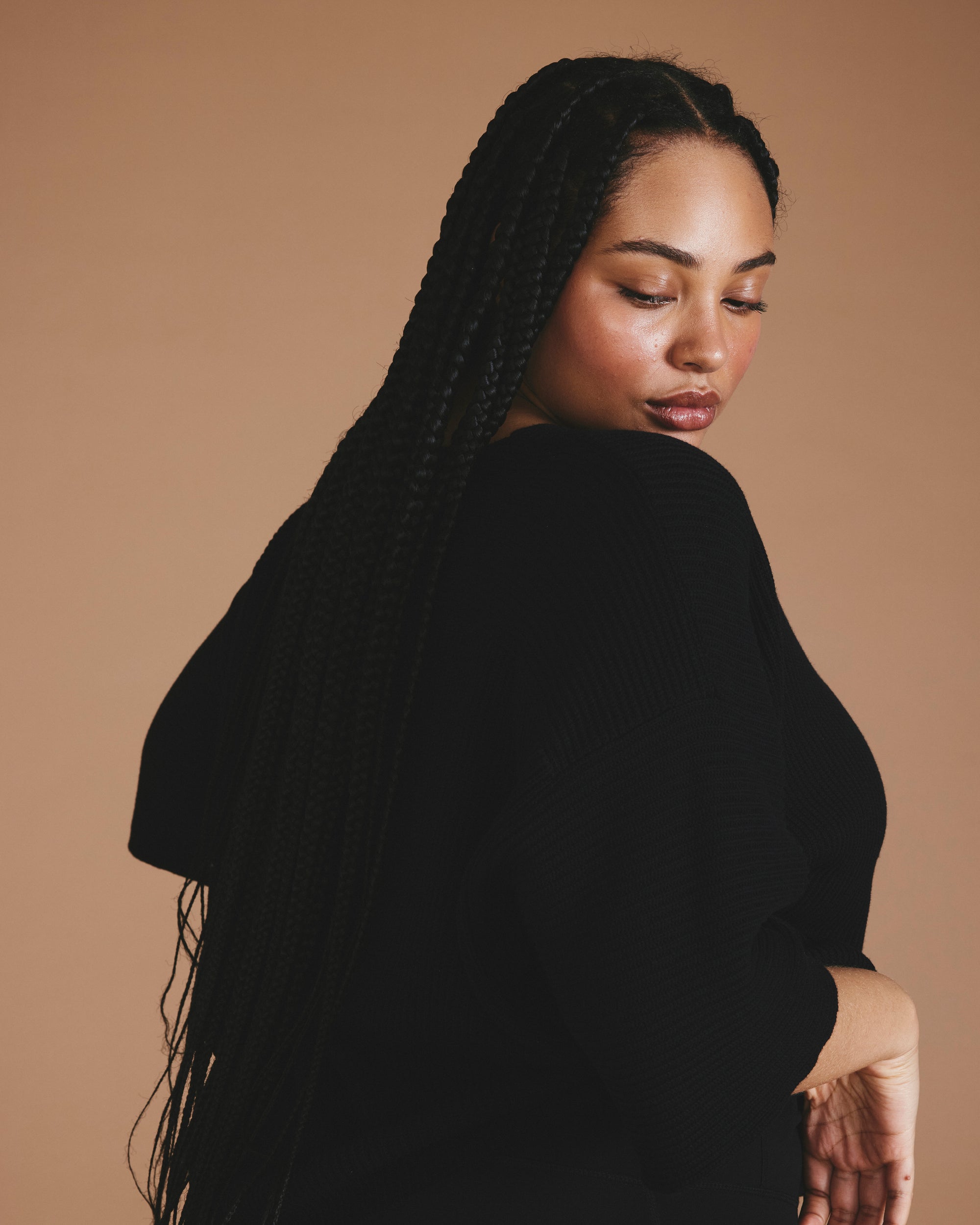 Woman wearing Lotus Sweater - Black from Universal Standard