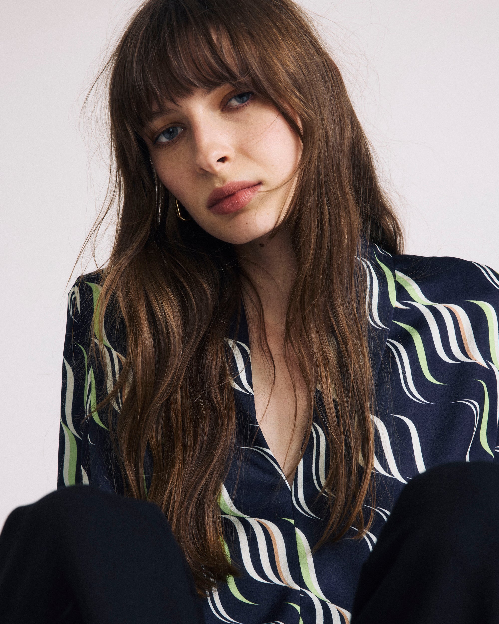 Woman wearing Georgette Satin Cambria Blouse - Paddington Ribbon Print from Universal Standard