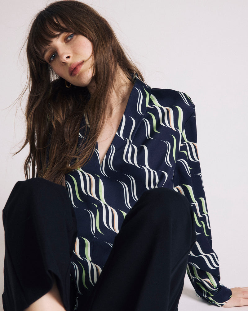 Woman wearing Georgette Satin Cambria Blouse - Paddington Ribbon Print from Universal Standard