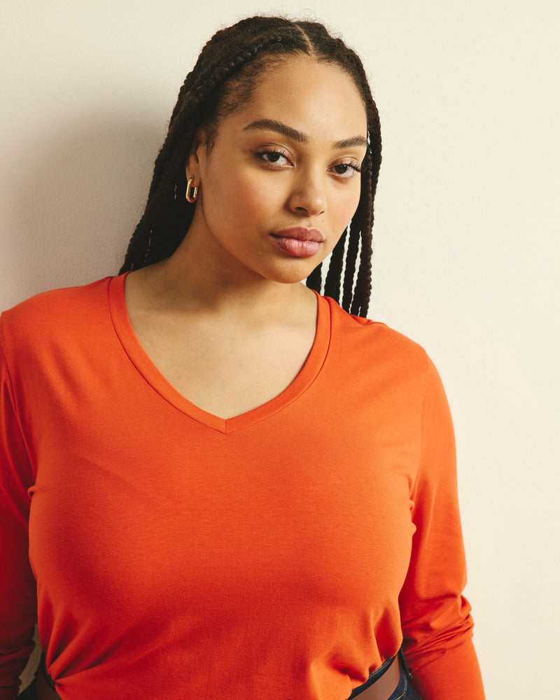Woman wearing Long Sleeve V Rex - Orange Flame from Universal Standard