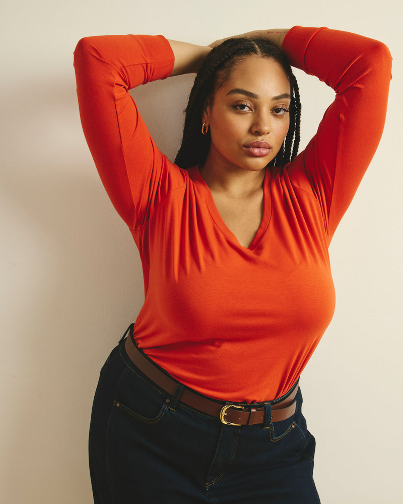 Woman wearing Long Sleeve V Rex - Orange Flame from Universal Standard