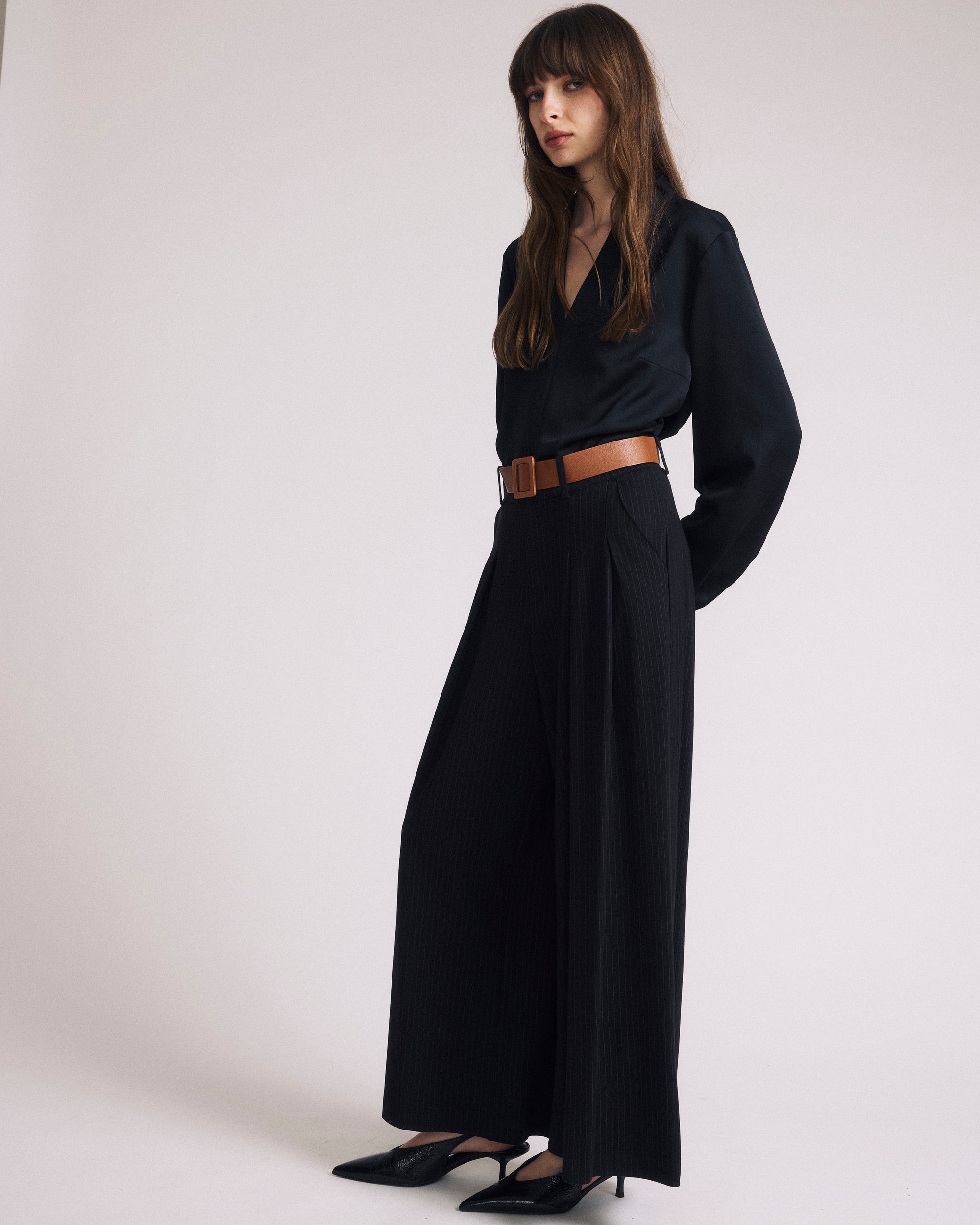 Woman wearing Georgette Satin Cambria Blouse - Black from Universal Standard