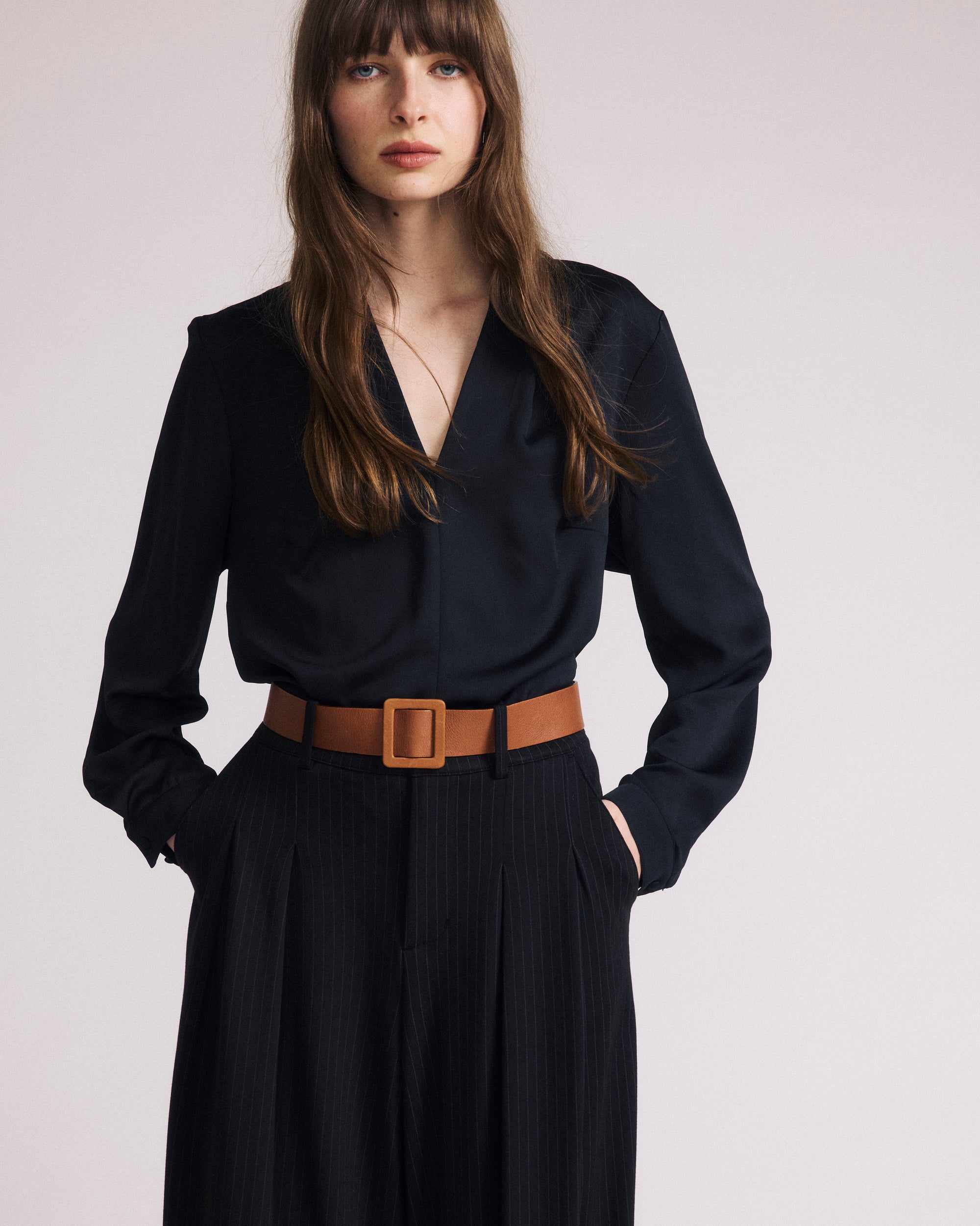 Woman wearing Georgette Satin Cambria Blouse - Black from Universal Standard