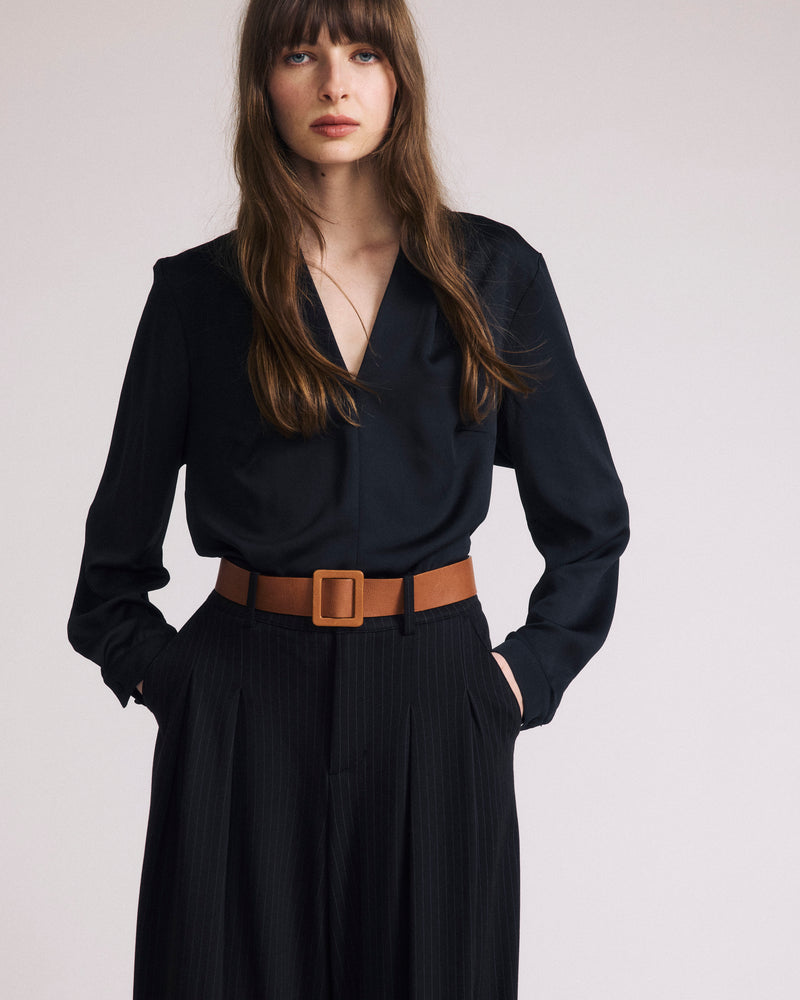 Woman wearing Georgette Satin Cambria Blouse - Black from Universal Standard