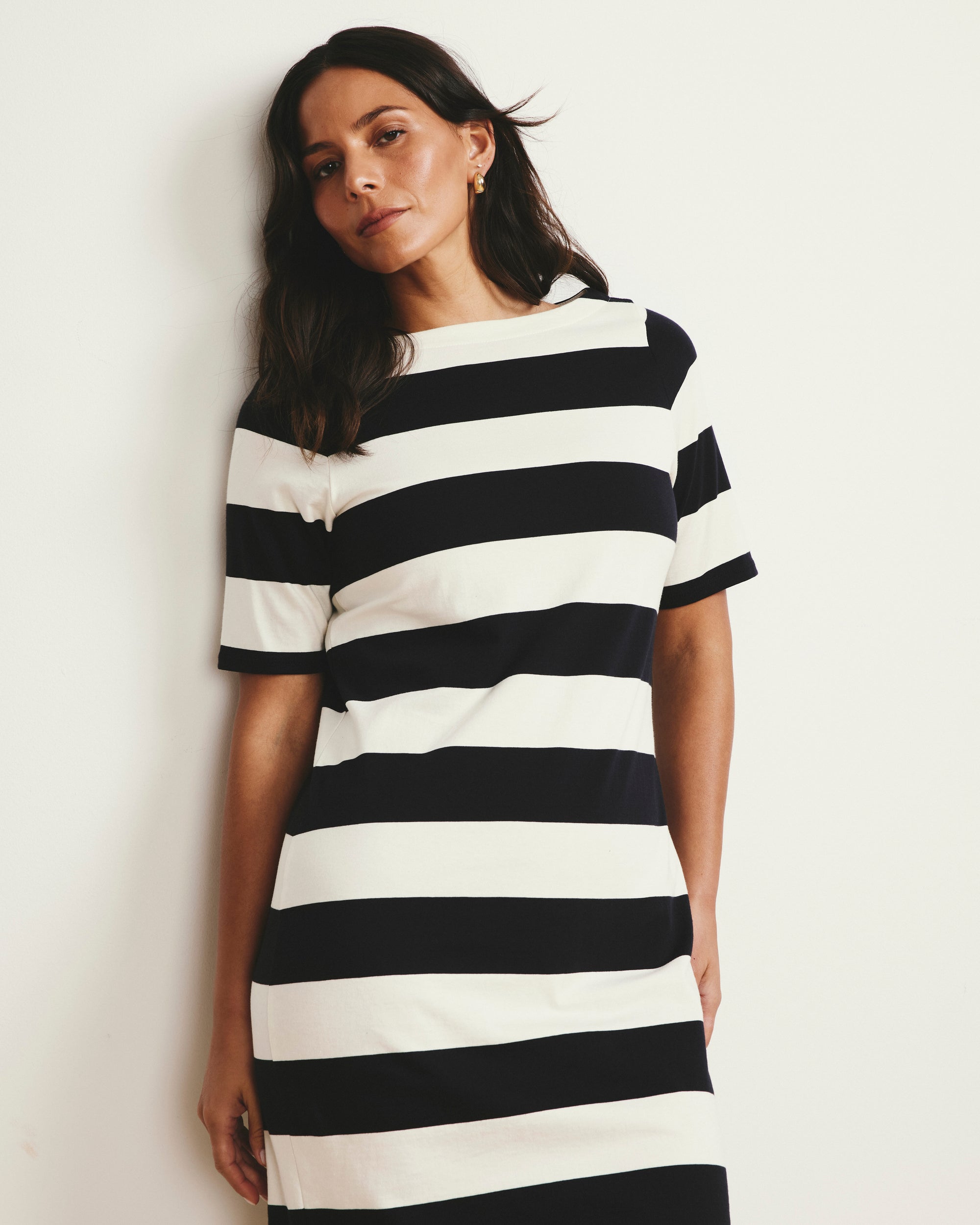 Woman wearing Belle Breton Stripe Jersey Dress - Ecru/Black Rugby Stripe from Universal Standard