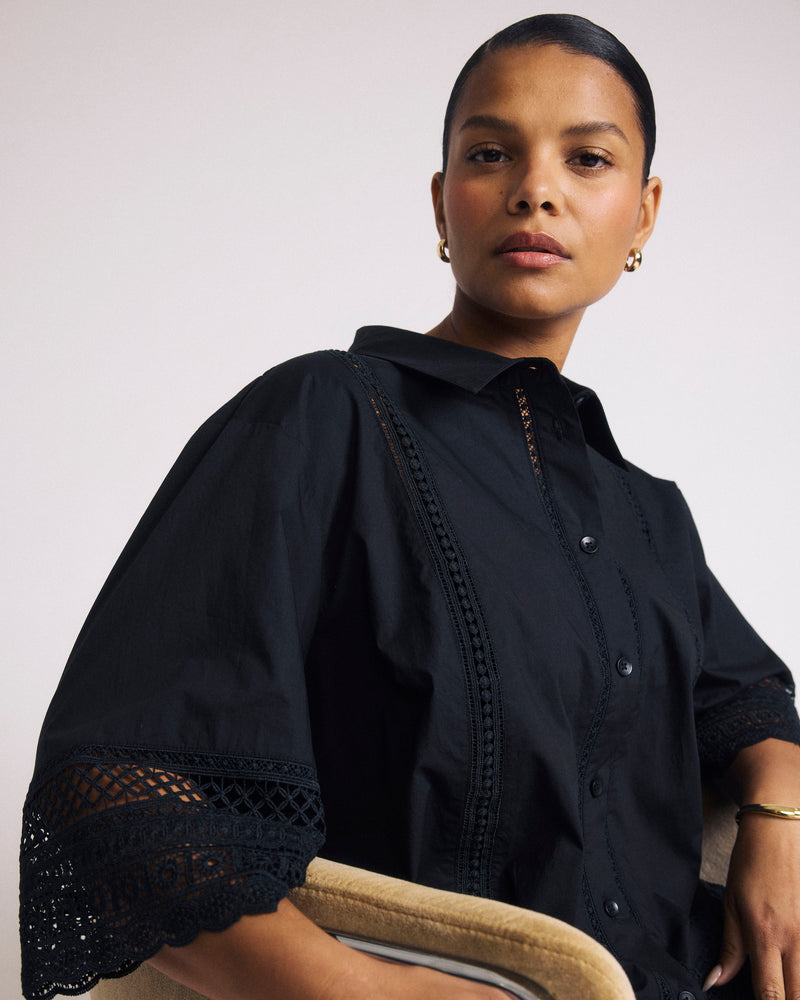 Woman wearing Dora Cotton Poplin Blouse - Black from Universal Standard