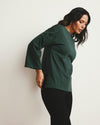 Woman wearing Montauk Breton Stripe Bell Sleeve Top - Solid Conifer from Universal Standard