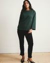 Woman wearing Montauk Breton Stripe Bell Sleeve Top - Solid Conifer from Universal Standard