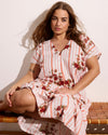 Woman wearing Louvre Bow Back Linen Dress - Wild Flower Bouquet Print on Stripes from Universal Standard