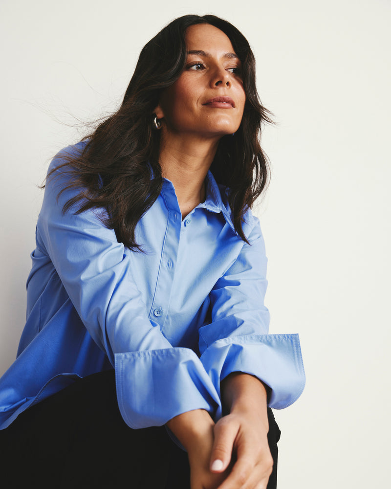 Woman wearing Henning x US Madison Shirt - Soft Blue from Universal Standard