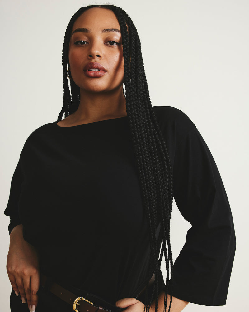 Woman wearing Montauk Breton Stripe Bell Sleeve Top - Solid Black from Universal Standard