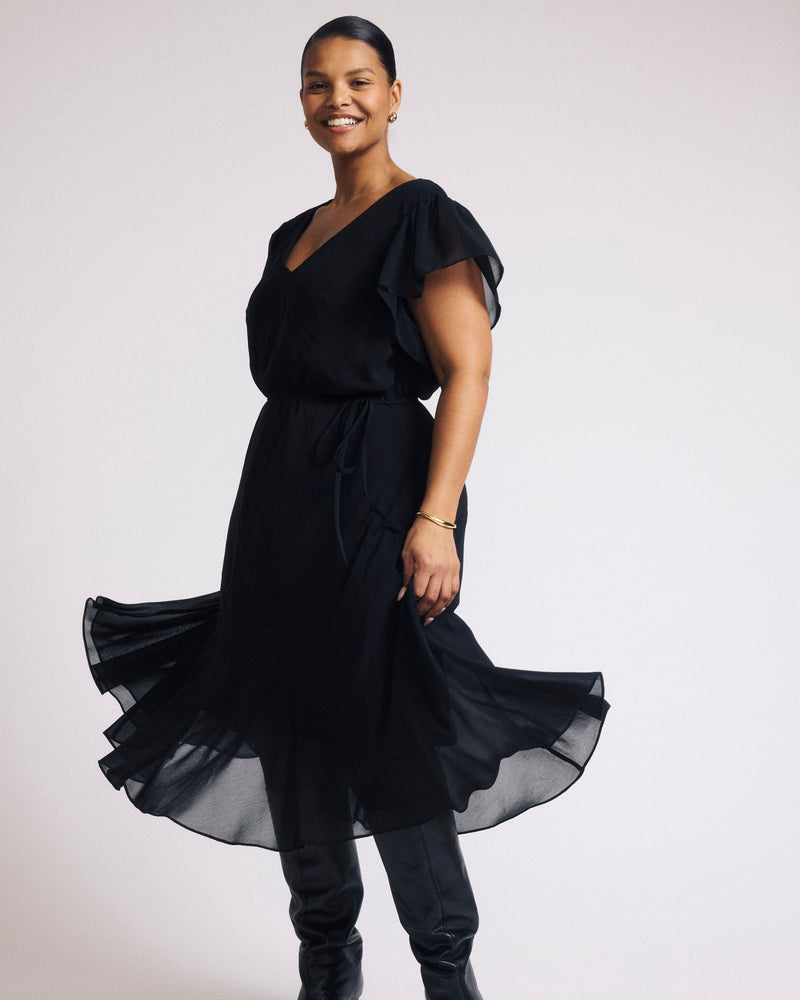 Woman wearing Seville Chiffon Dress - Black from Universal Standard