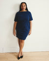 Woman wearing Belle Breton Stripe Jersey Dress - Deep Teal/Black Stripe from Universal Standard