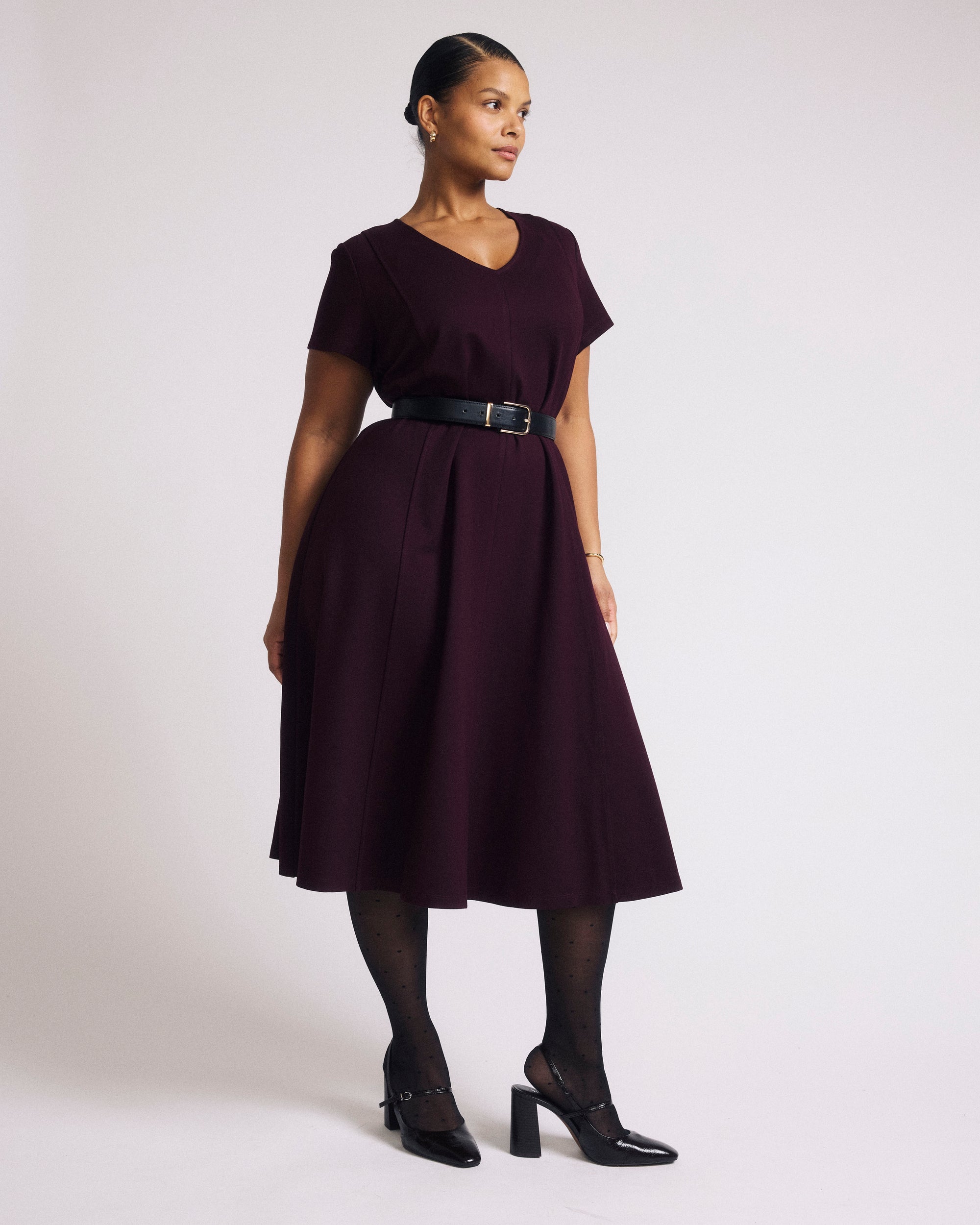 Woman wearing Lucinda Ponte Dress - Black Cherry from Universal Standard