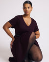 Woman wearing Lucinda Ponte Dress - Black Cherry from Universal Standard