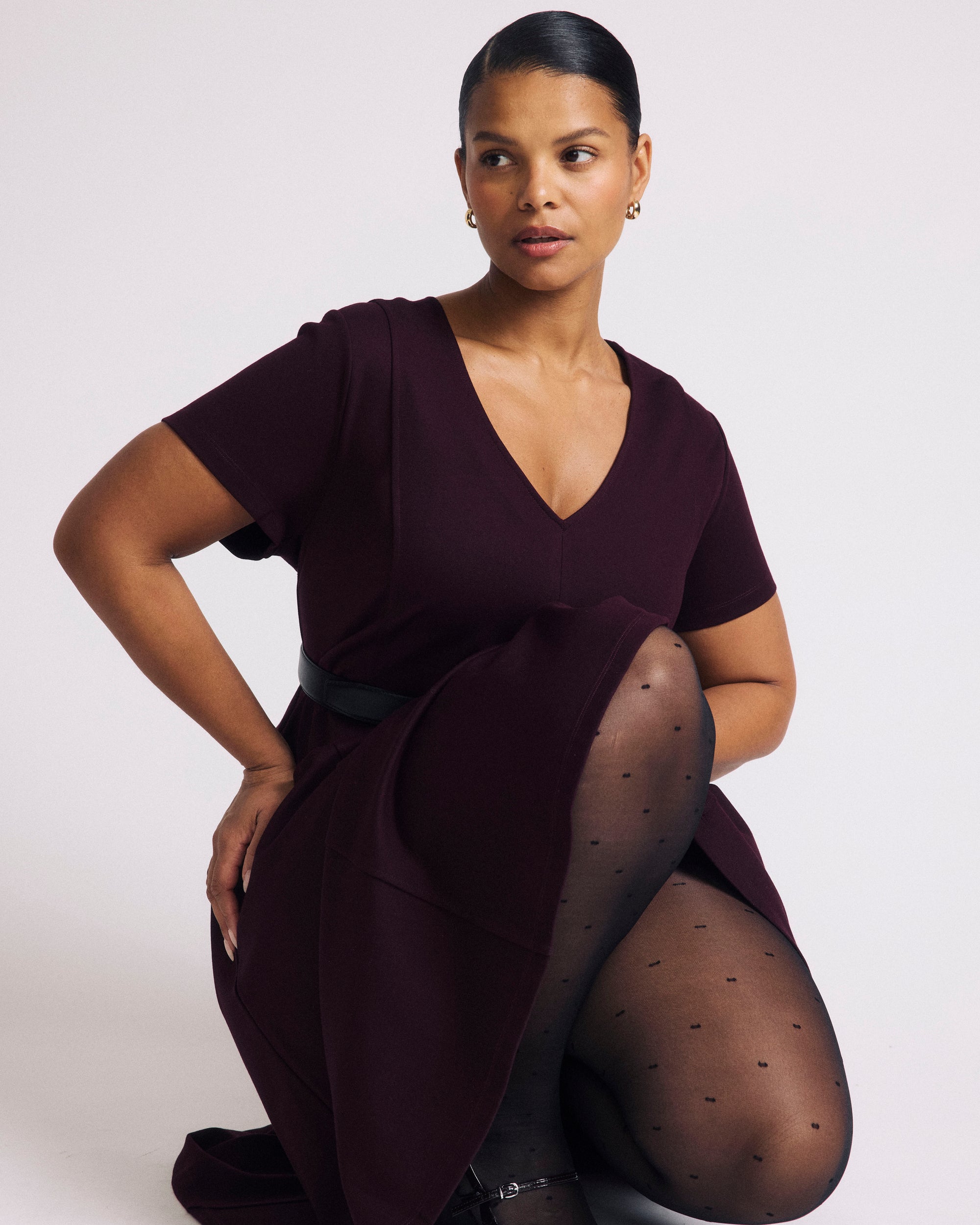 Woman wearing Lucinda Ponte Dress - Black Cherry from Universal Standard