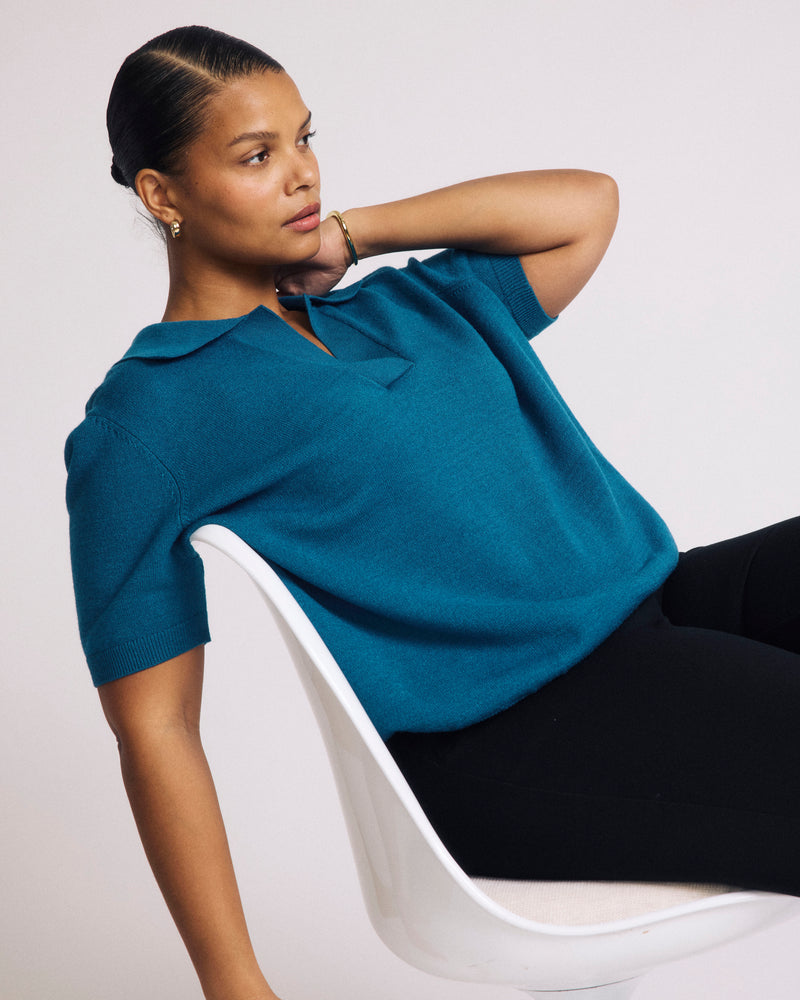 Woman wearing Savvy Fine Knit Short Sleeve Polo Sweater - Blue Beetle from Universal Standard