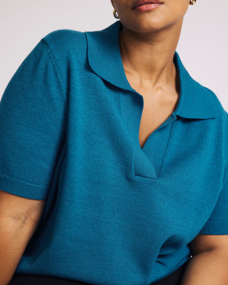 Woman wearing Savvy Fine Knit Short Sleeve Polo Sweater - Blue Beetle from Universal Standard