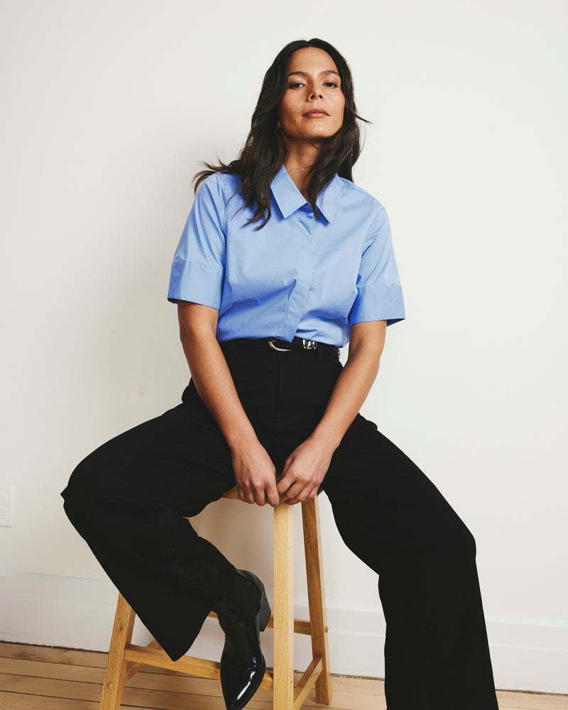 Woman wearing Elbe Stretch Poplin Short Sleeve Shirt - Soft Blue from Universal Standard