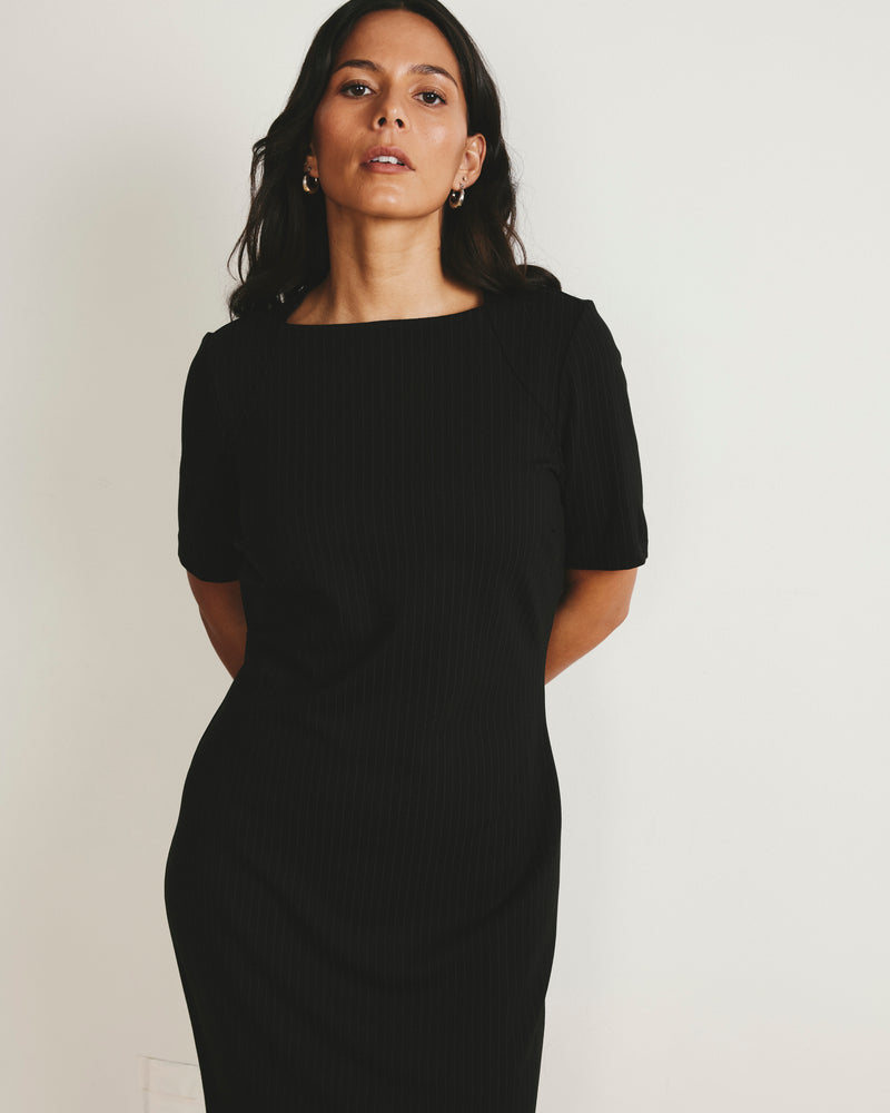 Woman wearing Envelope Neck Ponte Dress - Slate Pinstripe from Universal Standard