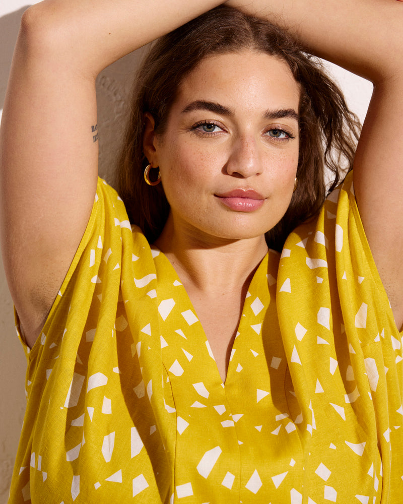 Woman wearing Cabana Linen Kaftan - Yellow Confetti Print from Universal Standard