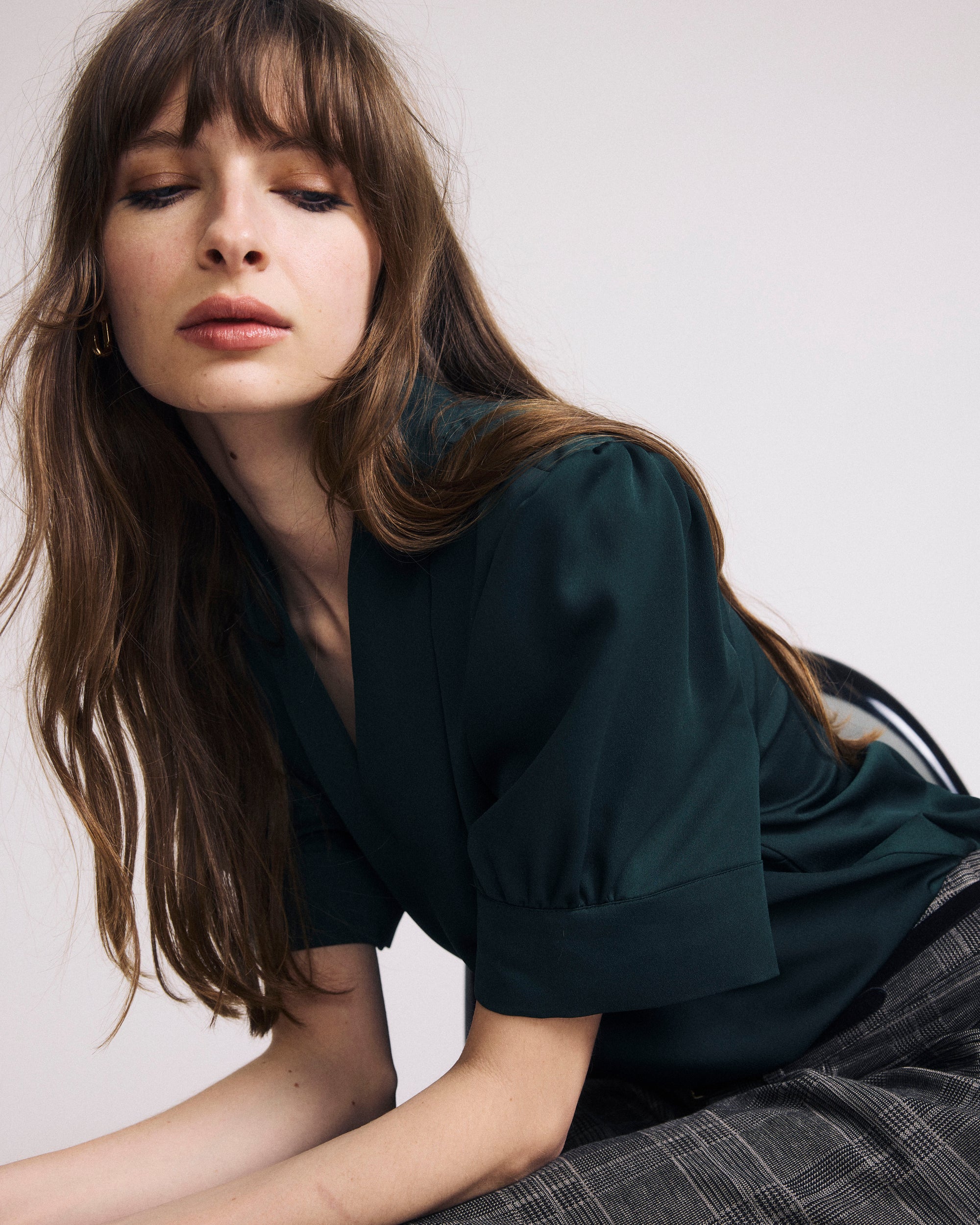 Woman wearing Beatrice Soft Satin Top - Forest Green from Universal Standard