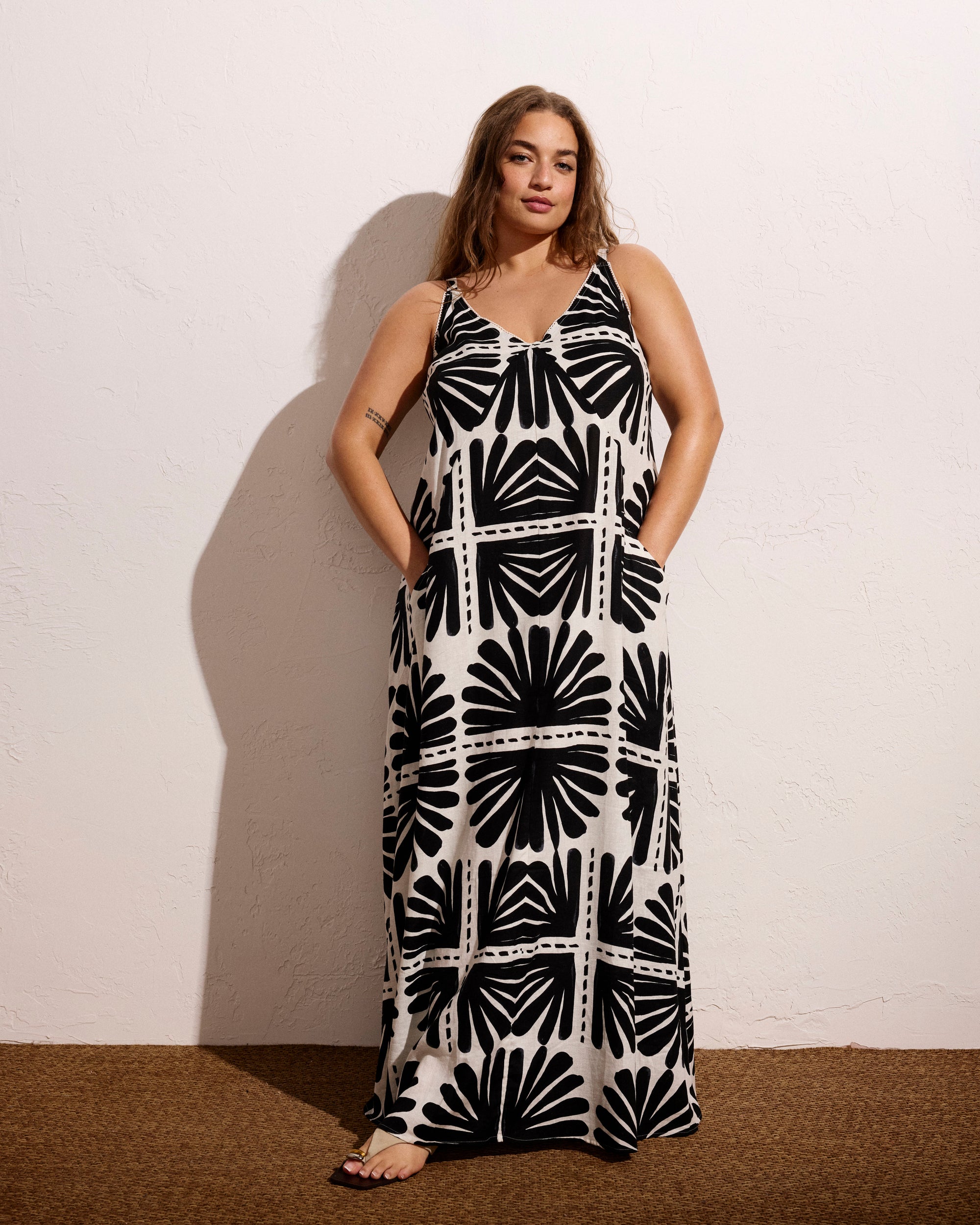 Woman wearing Kite Linen Dress - Ink Bloom Print from Universal Standard