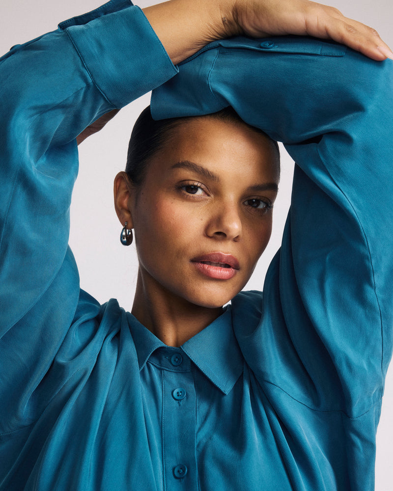 Woman wearing Cooling Stretch Cupro Artist Shirt - Blue Beetle from Universal Standard