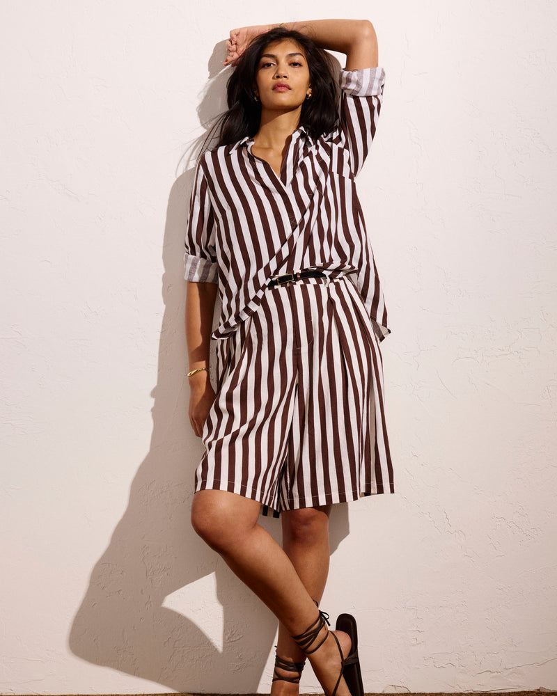 Woman wearing Seaport Tailored Linen Short - Peppercorn Stripe from Universal Standard